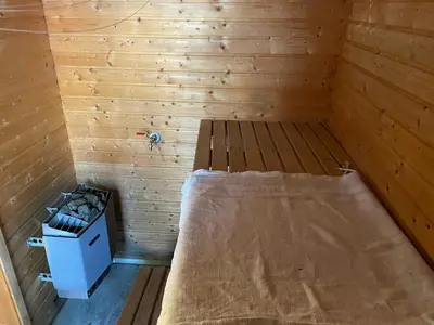 a small room with a bed in a sauna at Modernized Cabin At Norefjell With View in Eggedal