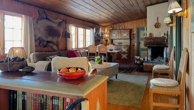 a living room with a couch and a table at Modernized Cabin At Norefjell With View in Eggedal