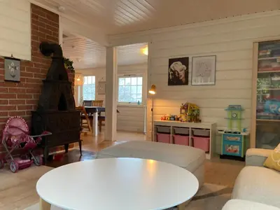 a living room with a couch and a table at Child-friendly holiday home in Ålesund