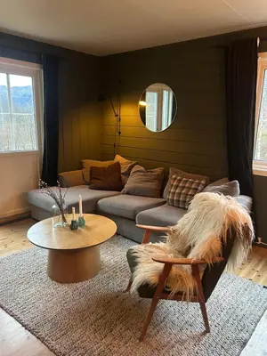 a living room with a couch and a table at Cabin in Valldalen, Røldal in Røldal