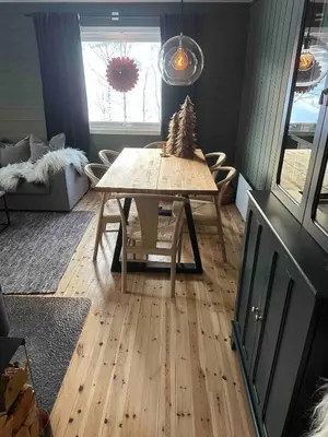 a living room with a table and a couch at Cabin in Valldalen, Røldal in Røldal