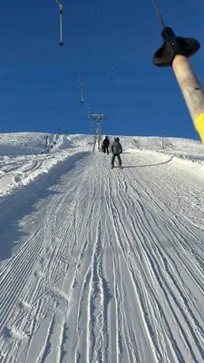 a group of people skiing down a snow covered slope at Cabin in Valldalen, Røldal in Røldal