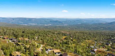 an aerial view of a village in a forest at The Holiday - Panorama Lodge in Lampeland