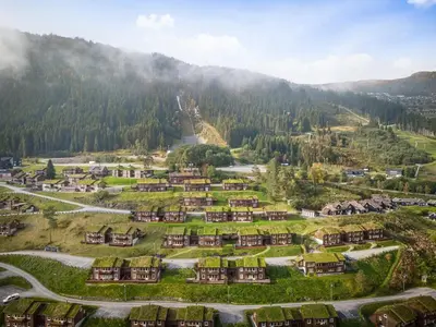 an aerial view of a village in the mountains at Lovely apartment with amazing view and sauna in Skulestadmo