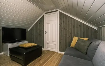 a living room with a couch and a flat screen tv at Family Cabin With Ski Inout In Rauland in Rauland