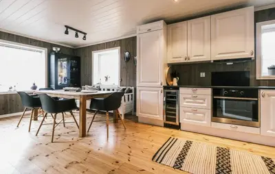 a kitchen with a table and chairs in it at Family Cabin With Ski Inout In Rauland in Rauland