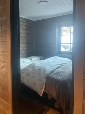 a bedroom with a bed and a window at Mountain Cabin With Panoramic Views In Savalen in Tynset