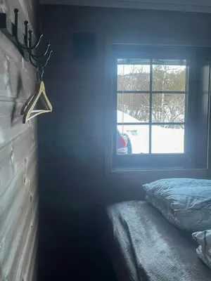 a bedroom with a bed and a window at Mountain Cabin With Panoramic Views In Savalen in Tynset