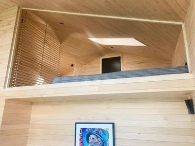 a room with a wooden ceiling and a picture at Architect-Designed Cabin With View In Molde in Røvik