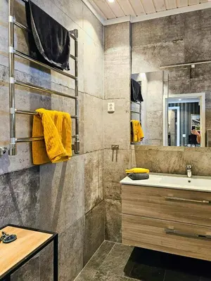 a bathroom with a sink and a mirror at Modern Cabin With Panoramic Views Near Langedrag in Tunhovd
