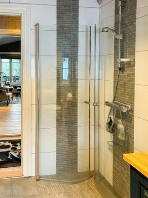 a shower with a glass door in a bathroom at Family Cabin With Ski In Ski Out in Trysil