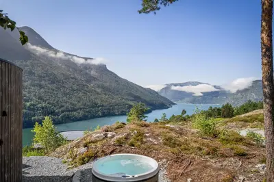 a view of a lake in the mountains at The Sognefjord Cabin in Kaupanger