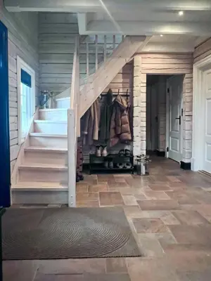 a room with a staircase and a stair case at Mountain Cabin With Panoramic Views At Hummelfjell in Os