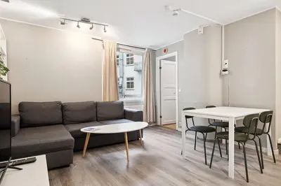 a living room with a couch and a table at Apt 500 m to Bryggen - Perfect location in Bergen