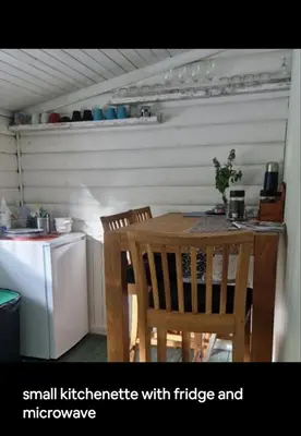 a small kitchen with a table and chairs at Holidays 4 rooms in Gol