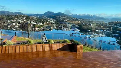 a view of a body of water from a balcony at Hytte Hammarslandbakken in Bergen