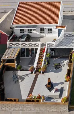 an aerial view of a house with a roof at Sjøhuset Sjøholt in Sjøholt