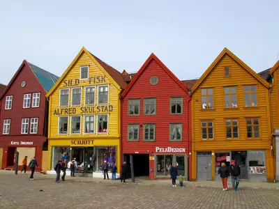 a group of colorful buildings on a street at Bergen City Center Apartment in Bergen