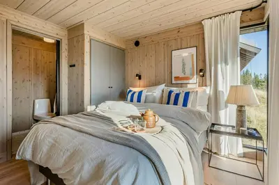 a bedroom with a large bed in a room at Modern Cabin With Ski In Out At Kvitfjell in Favang