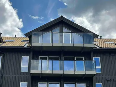 a house with glass windows on the roof at Gorgeous apartment in Geilo in Hol