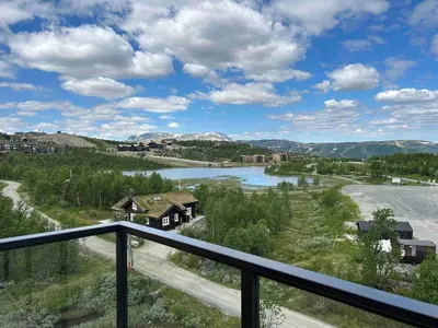 a view of a river from a balcony at Gorgeous apartment in Geilo in Hol