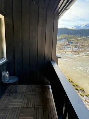 a wooden porch with a table and a view at Storehorn apartments, Hemsedal - 2 bedrooms, 5 beds in Torset