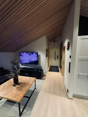 a living room with a large flat screen tv at Cozy Apartment in Melhus in Melhus