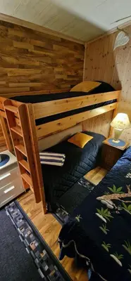 a bedroom with a bunk bed in a cabin at Cabin Room on DaVita Ranch in Tranhaug