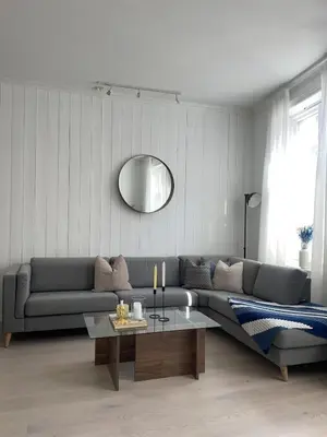 a living room with a couch and a table at Modern and Cosy apartment in Bergen City Centre in Bergen