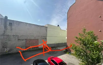 an orange ribbon on the side of a building at Stylish free parking Studio central with balcony in Ålesund