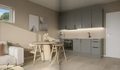 a kitchen and living room with a table and chairs at Modern apartment by the sea in Bergen