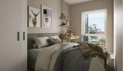 a bedroom with a bed with a deer picture on the wall at Modern apartment by the sea in Bergen