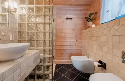 a bathroom with a toilet and a sink at Modern Cabin With Ski In-Out In Hafjell in Øyer