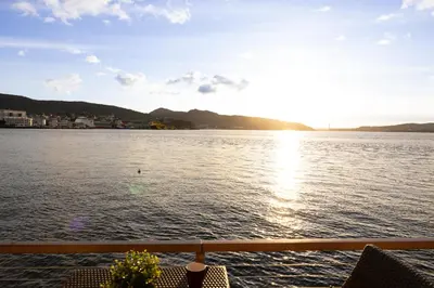 a view of the water from a boat at Heimby Homes - Balcony above the sea in Bergen