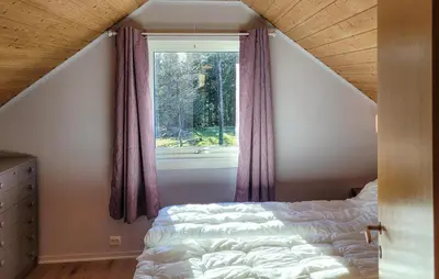 a bedroom with a bed and a window at 1 Bedroom Amazing Apartment In Stord in Stord