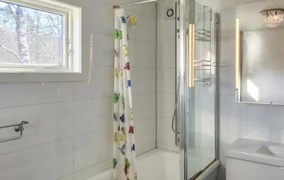 a bathroom with a shower and a sink at 1 Bedroom Amazing Apartment In Stord in Stord