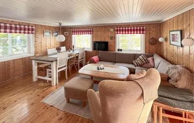 a living room with a couch and a table at Beautiful Home In Vang På Hedmarken in Sæli