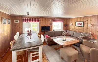a living room with a couch and a table at Beautiful Home In Vang På Hedmarken in Sæli