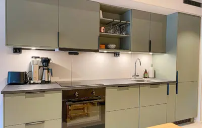 a kitchen with gray cabinets and a sink at 2 Bedroom Gorgeous Home In Bjorli in Bjorli