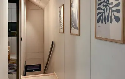 a hallway with pictures on the wall and a staircase at 2 Bedroom Gorgeous Home In Bjorli in Bjorli