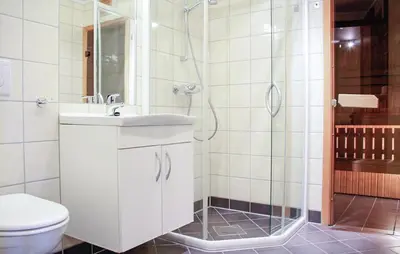 a bathroom with a toilet and a sink and a shower at Lovely Apartment In Hemsedal With Sauna in Hemsedal