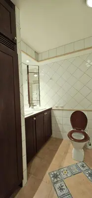 a bathroom with a toilet and a sink at Midt i byn in Bergen