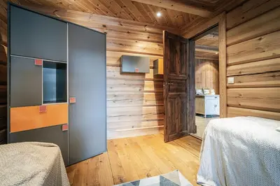 a bedroom with wooden walls and a tv and a bed at Vacation house in Hemsedal in Hemsedal