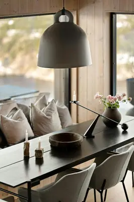 a black table with two candles and a couch at Cabin Overlooking Ryfylke Fjord in Høyvik