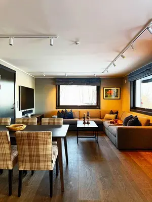 a living room with a couch and a table at Geilolie - apartment in Geilo in Geilo