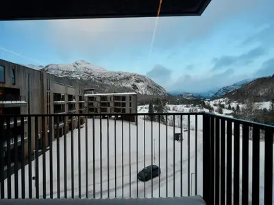 a balcony with a view of a snow covered mountain at Ski in & out - Hemsedal in Kyrkjebøen