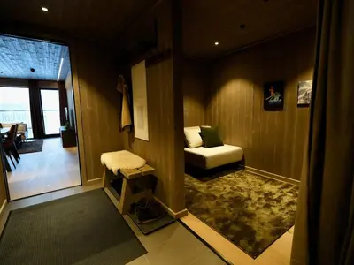 a living room with a couch and a chair at Ski in & out - Hemsedal in Kyrkjebøen