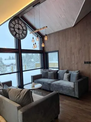 a living room with two couches and a table at Veltelia Resort in Nes i Ådal