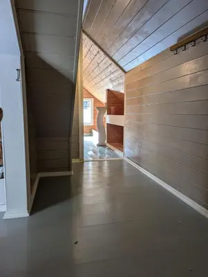 a hallway of a house with a wooden ceiling at Charming guest house with amazing view in Kvam