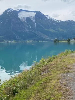 a view of a lake with mountains in the background at Faleide View in Stryn